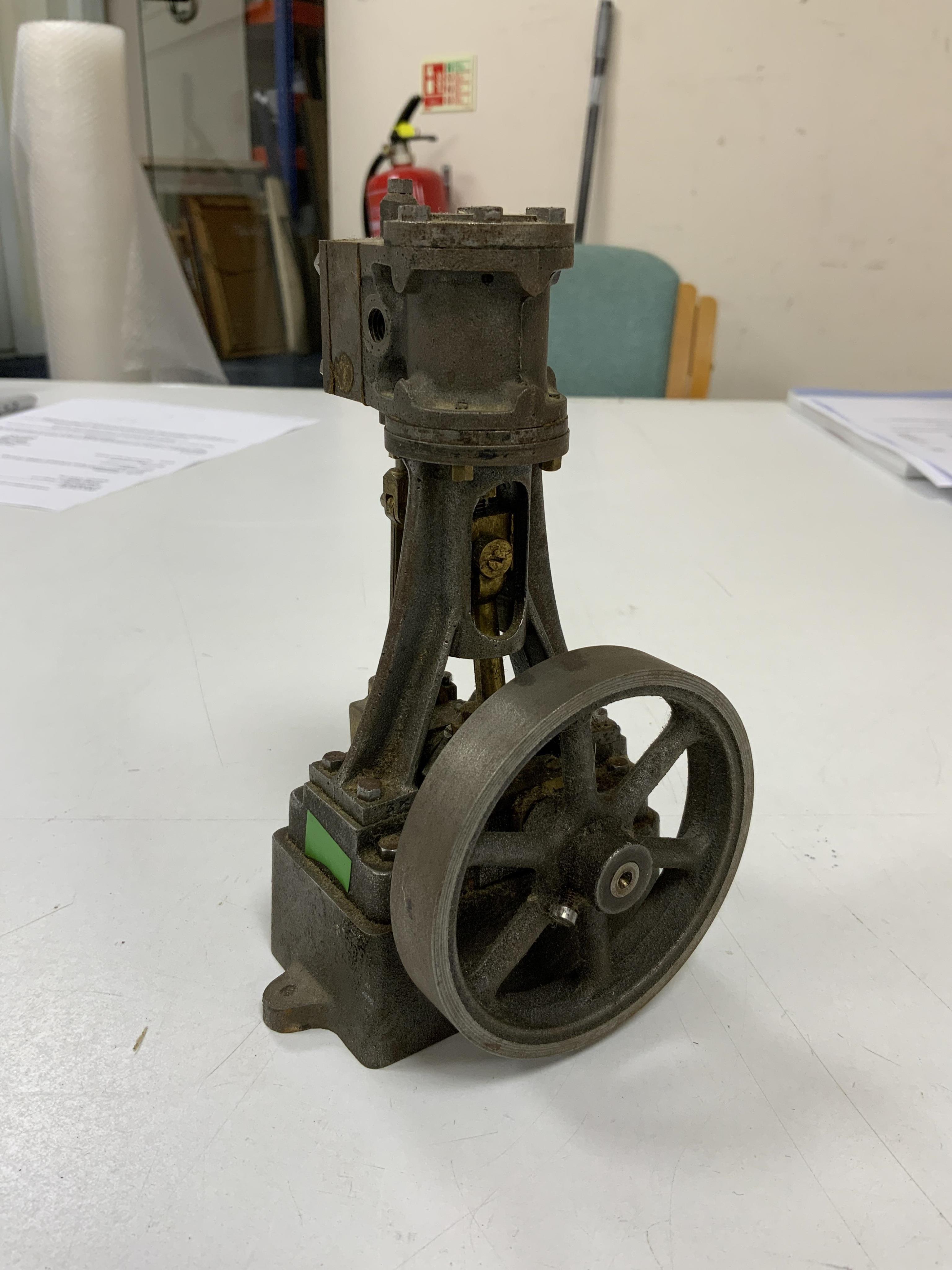 A Stuart No.10 vertical live steam single cylinder stationary engine, together with the original instruction booklets, a book on Sterling engines, and a quantity of useful ferrous and non-ferrous rods